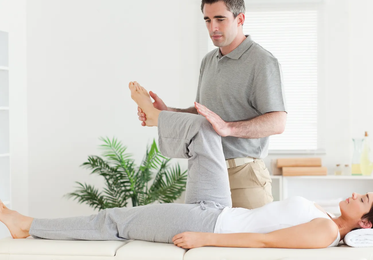 Dr. Eric Miller performing a hands-on chiropractic adjustment at Chiro-Med Health & Wellness Centers